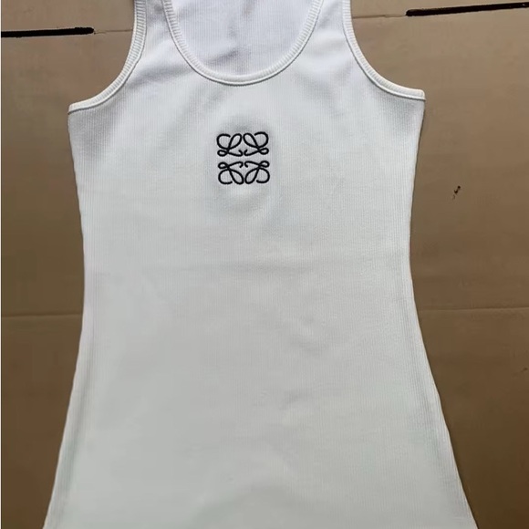 White Sleeveless Top-Is 2X but runs small.